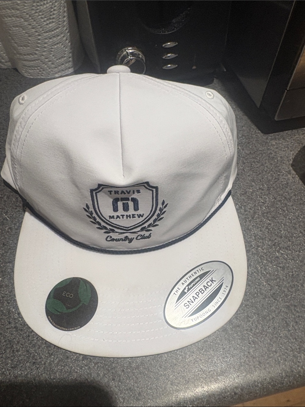 Travis Mathew White Snapback with Navy Logo and Trim